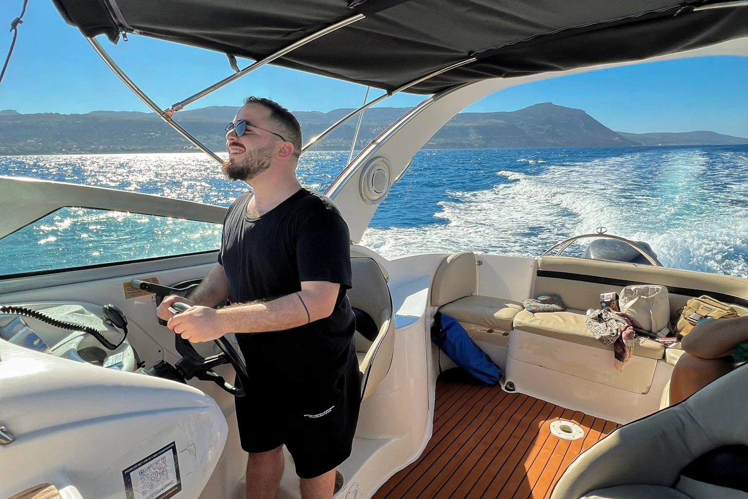 Nabil Khaled at the helm of a boat, after launching Digiredo and Freyusion