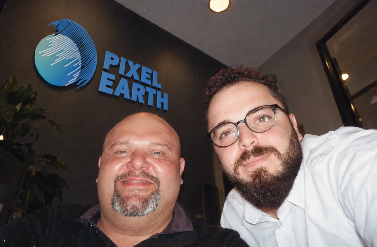 Nabil Khaled with a colleague under the Pixel Earth sign