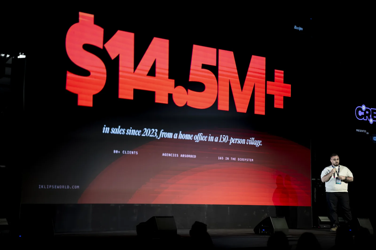 Nabil Khaled on stage at Doers Summit 2026 beside a screen reading $14.5M+ in sales since 2023