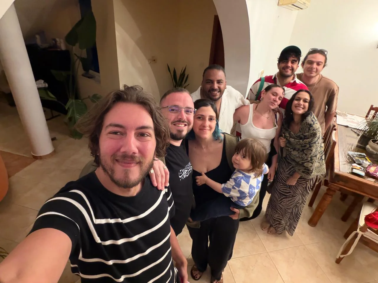 Nabil Khaled with his team and their families at a dinner at home